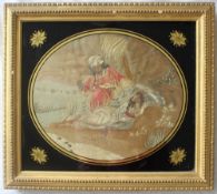 A George III silkwork picture of oval form depicting a figure in a turban and a reclining maiden