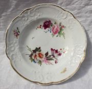 A Nantgarw porcelain bowl, painted with two floral sprays, a moth and a sprig of honeysuckle,