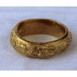 A Chinese yellow metal ring,