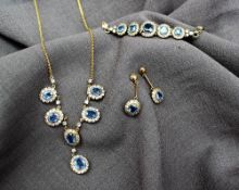 A cornflower blue and white sapphire necklace,