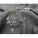 A cornflower blue and white sapphire necklace,