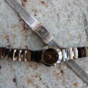 A Lady's Rotary wristwatch with a rectangular dial and integral strap together with another Lady's