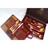 A Solingen gold plated flatware service, with a beaded edge and a place setting for twelve,