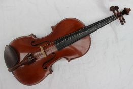 A Violin with a two piece back and ebonised line border, bears a label for Bohuslav Bocek,