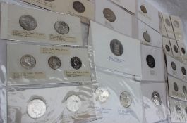 An album of white metal coins and medallions including Marie Theresia Thalers,