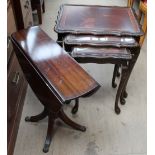 A reproduction mahogany drop leaf table,