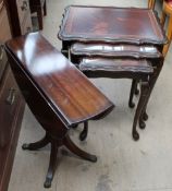 A reproduction mahogany drop leaf table,