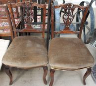 A pair of Edwardian salon chairs