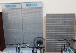 Two Oxford essential riders equipment display racks together with another display rack and a