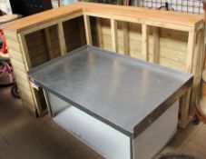 A pine counter with a metal topped insert