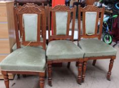 A set of four Edwardian upholstered salon chairs together with a marble topped coffee table