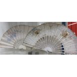 A silk fan with pierced bone guard sticks,