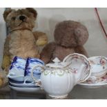 Two teddy bears together with tea cups and saucers etc