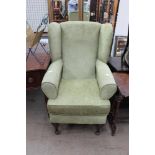 A green upholstered high leg,