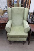 A green upholstered high leg,