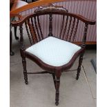 An Edwardian marquetry decorated corner chair