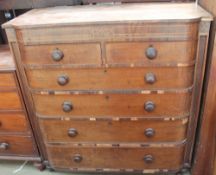 A large 19th century mahogany chest with two short and four long graduated drawers on turned feet