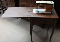 A Capri electric sewing machine and table