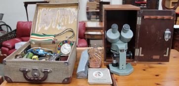 A large leather bag, together with rackets, Microscope, weighing scales,