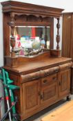 An Edwardian mirror back sideboard with drawers and cupboards