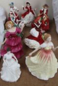 A Royal Doulton figure Christmas Day 2010 together with seven other Royal Doulton figures