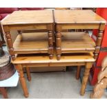 A modern pine consul table together with three pine side tables