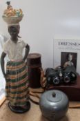 A Nao figure of an African lady, together with a pair of Carl Zeiss Octarem 8 x 50B binoculars,