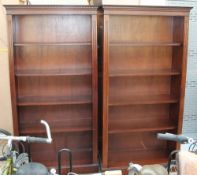 A set of four reproduction mahogany bookcases