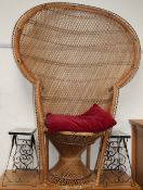 A wicker work peacock type chair together with a pair of tile top side tables