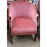 An Edwardian mahogany tub chair on square tapering legs and casters