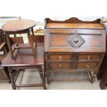 A 20th century oak bureau together with two oak side tables