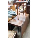 A 19th century mahogany gateleg dining table together with an occasional table