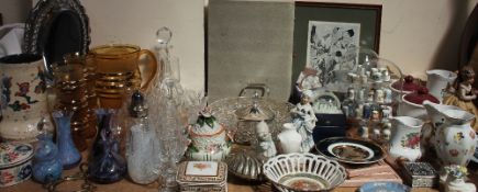 A glass decanter together with drinking glasses, a glass lemonade set, paperweights,