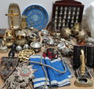 A cased display of thimbles together with assorted brass wares, flat iron stand,