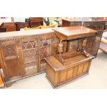 A 20th century oak bookcase together with an oak table,