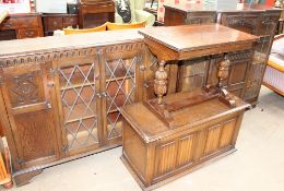 A 20th century oak bookcase together with an oak table,