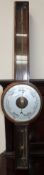 A demonstration wheel barometer with mercury tube