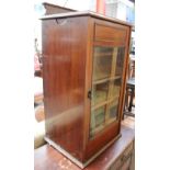 A mahogany pot cupboard with a glazed door and shelves