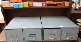 A pair of grey metal card index filing cabinets together with a table top filing cabinet and photo