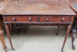 A Victorian mahogany side table with a rectangular top and rounded corners above a pair of drawers