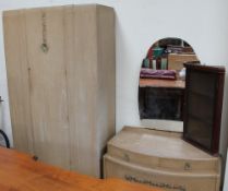 A limed oak wardrobe with matching dressing table,