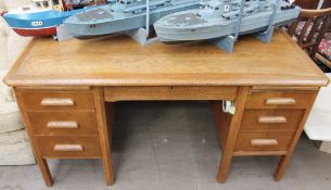 A 20th century oak desk and a glass table top