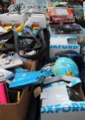 A large collection of bicycle accessories, bicycle helmets, racks,