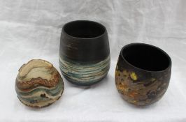 Studio pottery by Barbara Ineson - An oval pottery vase decorated with bands of black,