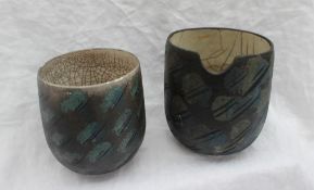 Studio pottery by Barbara Ineson - A pottery vase with a black ground decorated in blues and greens,