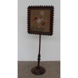 A Victorian walnut pole screen,