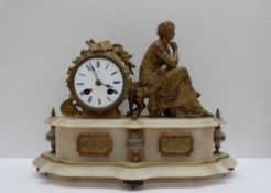 A 19th century gilt metal and alabaster mantle clock, with a seated female figure holding a mask,