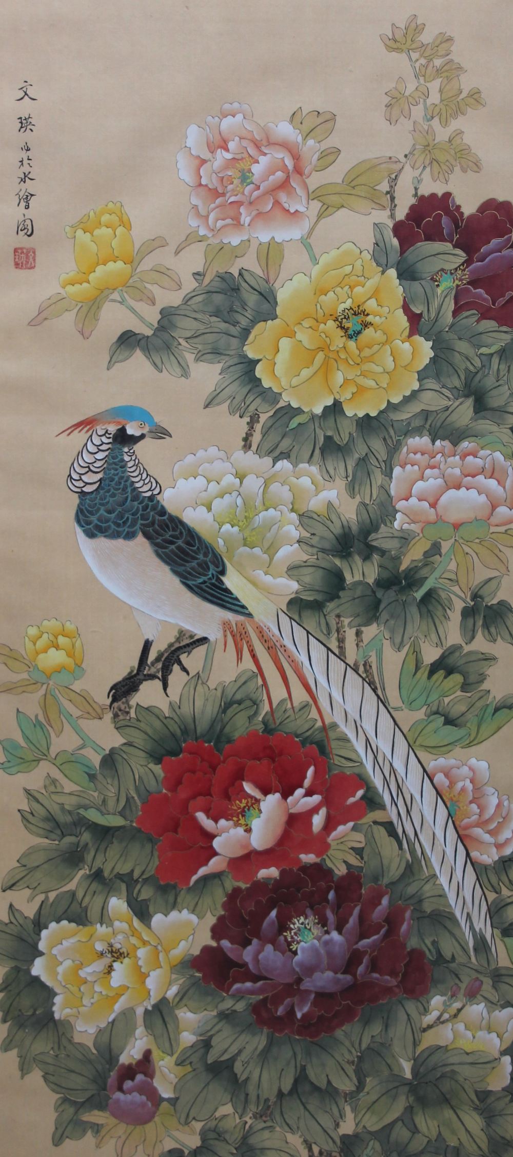 A Chinese silk panel painted with birds and flowers together with two other silkwork pictures and