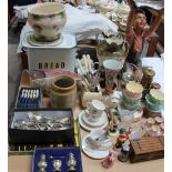 A plaster figure of a boy, together with Royal Winton dishes, miners lamps, flatwares, cruet set,