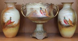 A garniture of three Crown Ducal vases by Holmes